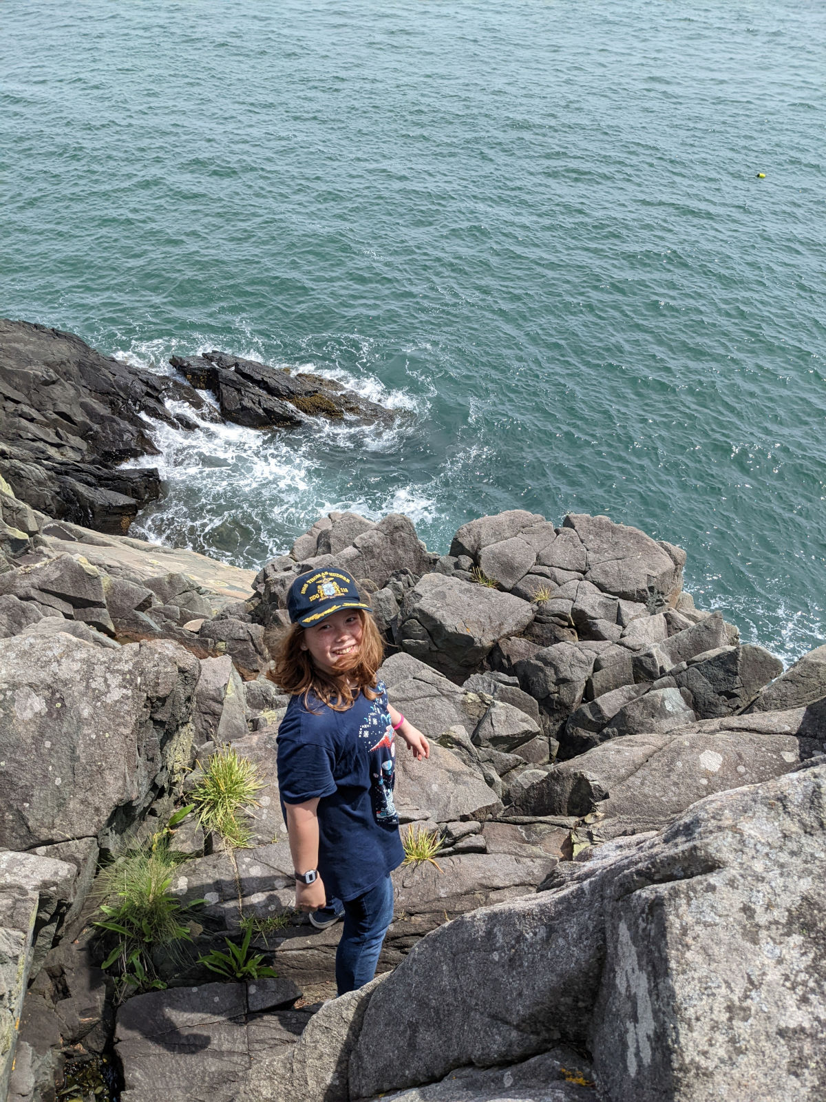 Fiona smiling up from the rocks