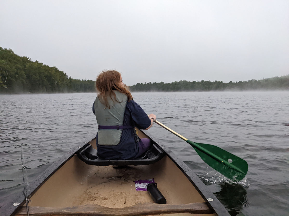 Fiona paddling in the bow seat