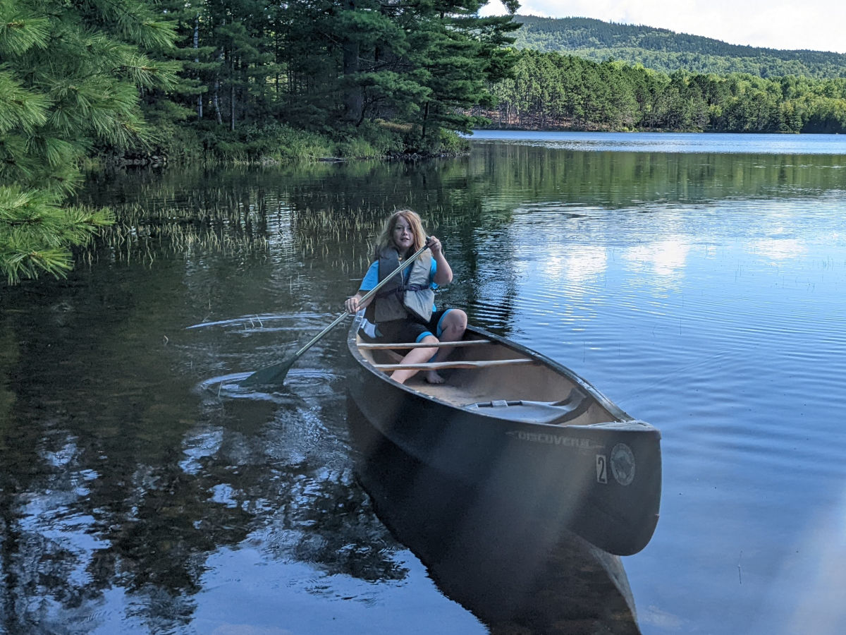 Fiona maneuvering the canoe close to shore