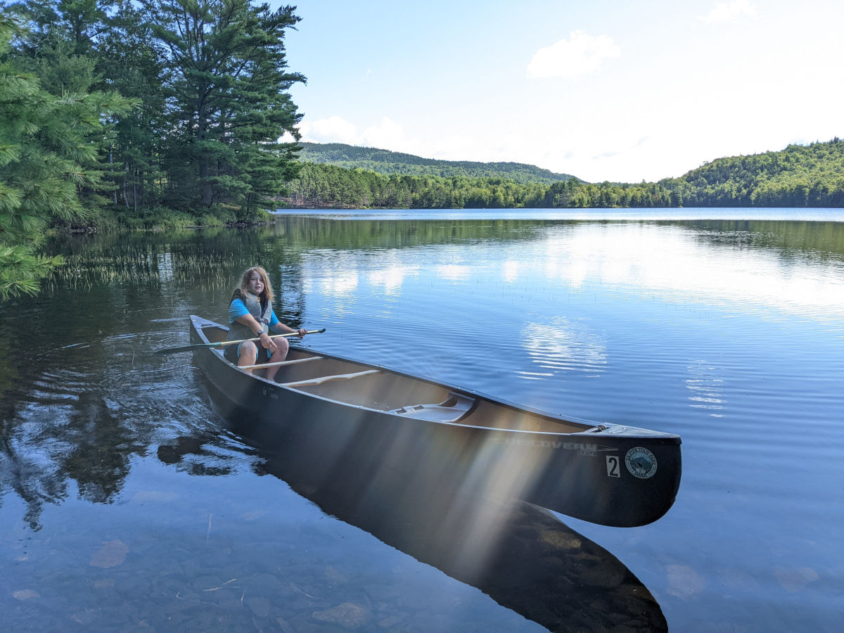 Fiona maneuvering the canoe close to shore different angle