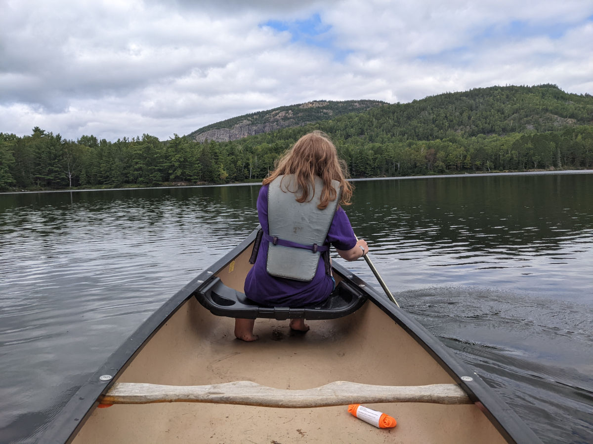 Fiona in the bow seat padding in better weather, different part of stroke