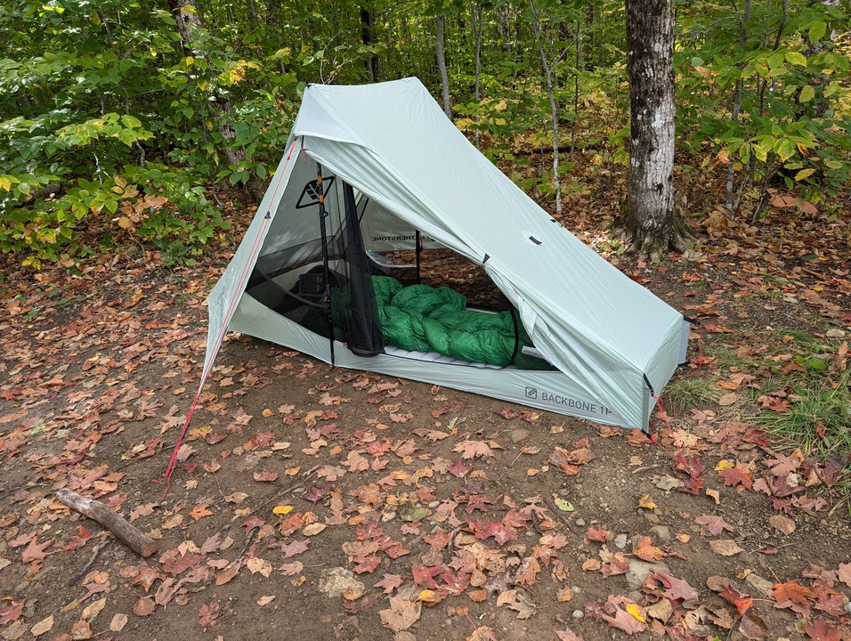 Tent set up with sleeping pad and bag visible through open vestibule