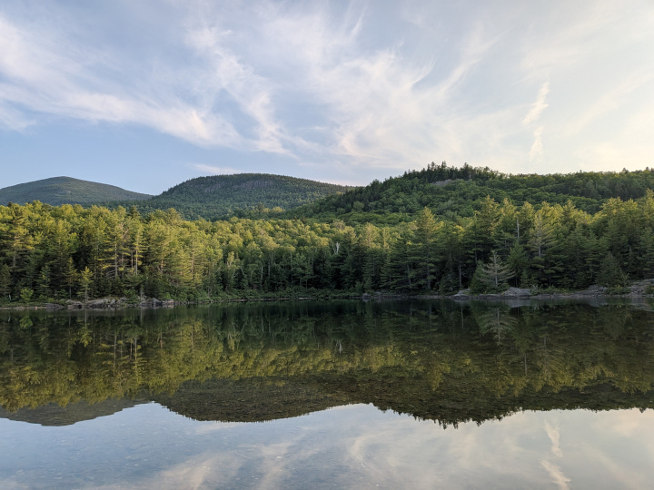 North Traveler Mountain and Barrel Ridge reflected on very calm Middle Fowler Pond
