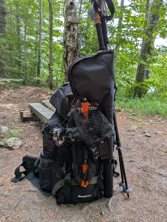 Backpack packed up and ready to go with fishing gear strapped to outside