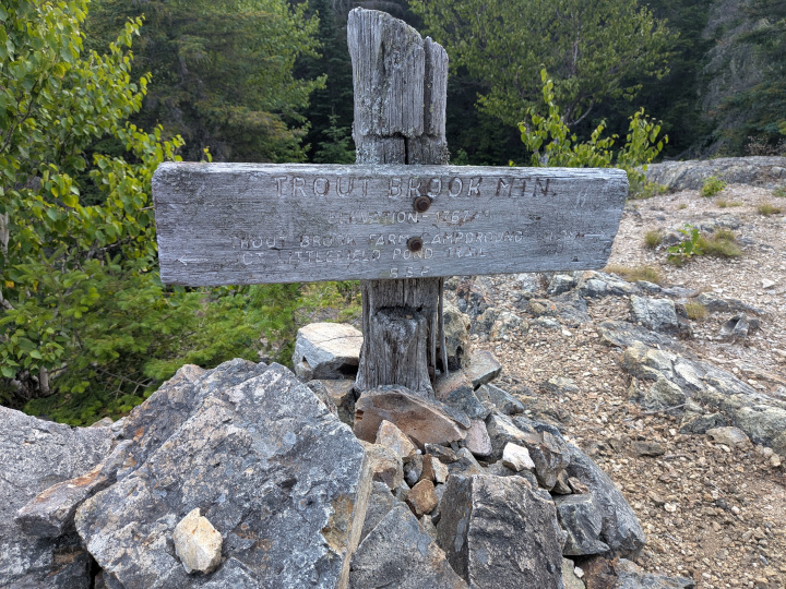 Worn out and unreadable sign at the peak of Trout Brook Mountain